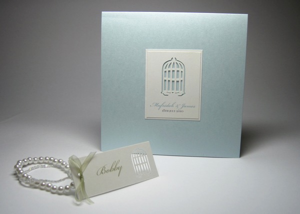 The invitations are made with a really beautifully crafted bird cage popup