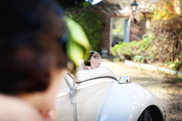 Bride looking in the wing mirror of a VW Beetle Good Day Sunshine Bridal