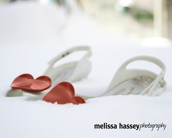 Picture of a pair of wedding bridal shoes in the snow by Melissa Hassey Photography