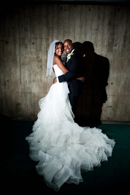 Picture of a bride and groom hugging each other and looking into the camera by Sean Casey Photography
