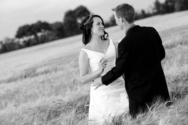Bride and groom in a field - Picture by Rusty and Sailor Photography