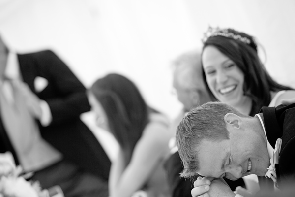 Bride and groom laughing at the top table - Picture by Rusty and Sailor Photography