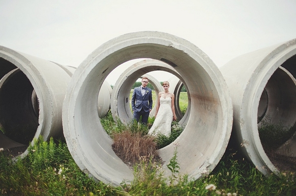 Picture of bride and groom taken through a concrete pipe - Picture by Josh Dookhie Photography
