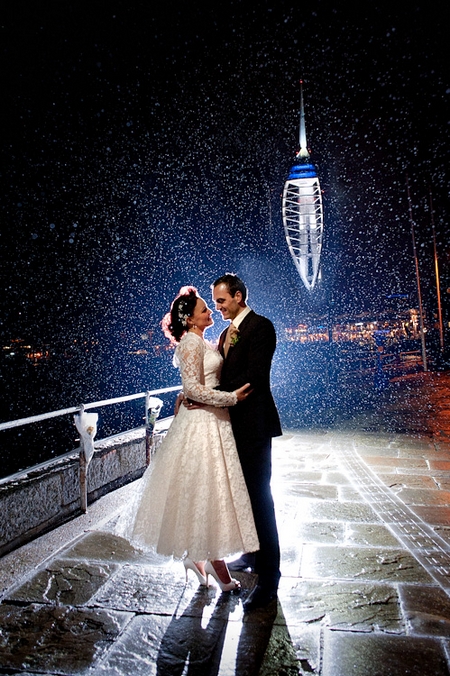 Bride and groom standing on bridge in rain - Picture by Lemontree Photography